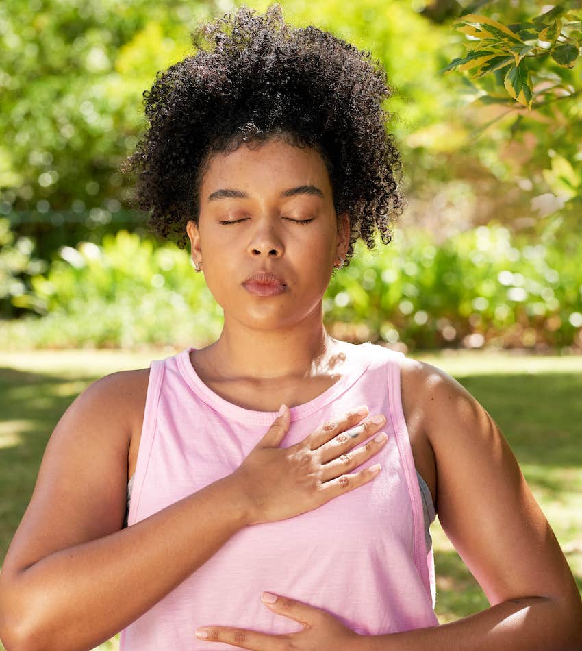 Spiritual woman practices breath work