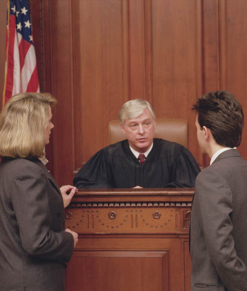 judge in courtroom talking to attorneys