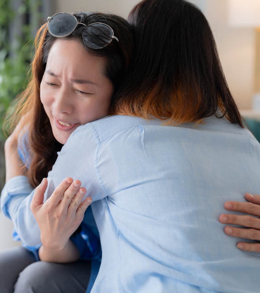 Woman hugs empathetic person after a good cry 