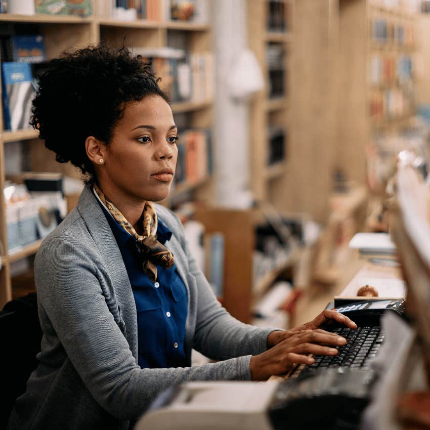 librarian typing on a computer