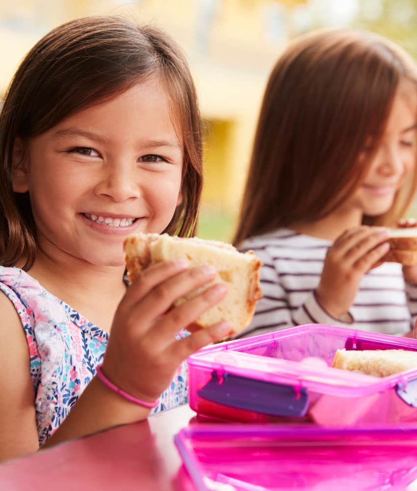 little girls eating lunch at school