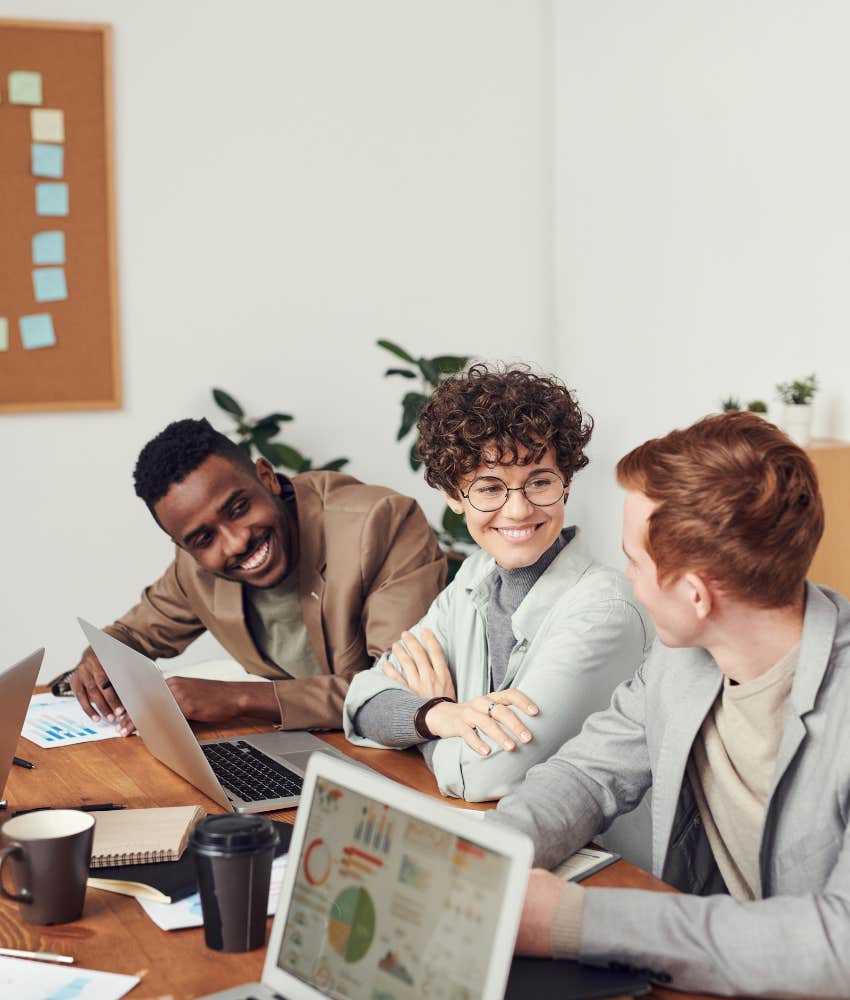 three employees working together