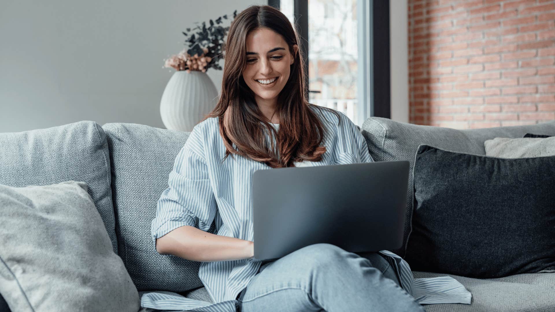 woman doing research in living room 