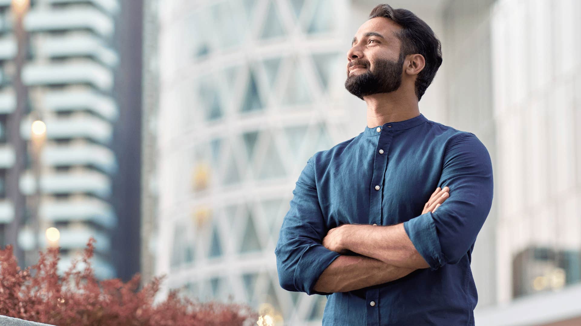 man looking confident and crossing arms