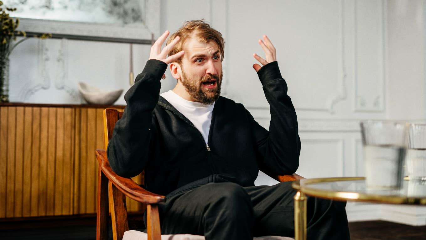 Man sitting in chair having an existential crisis.