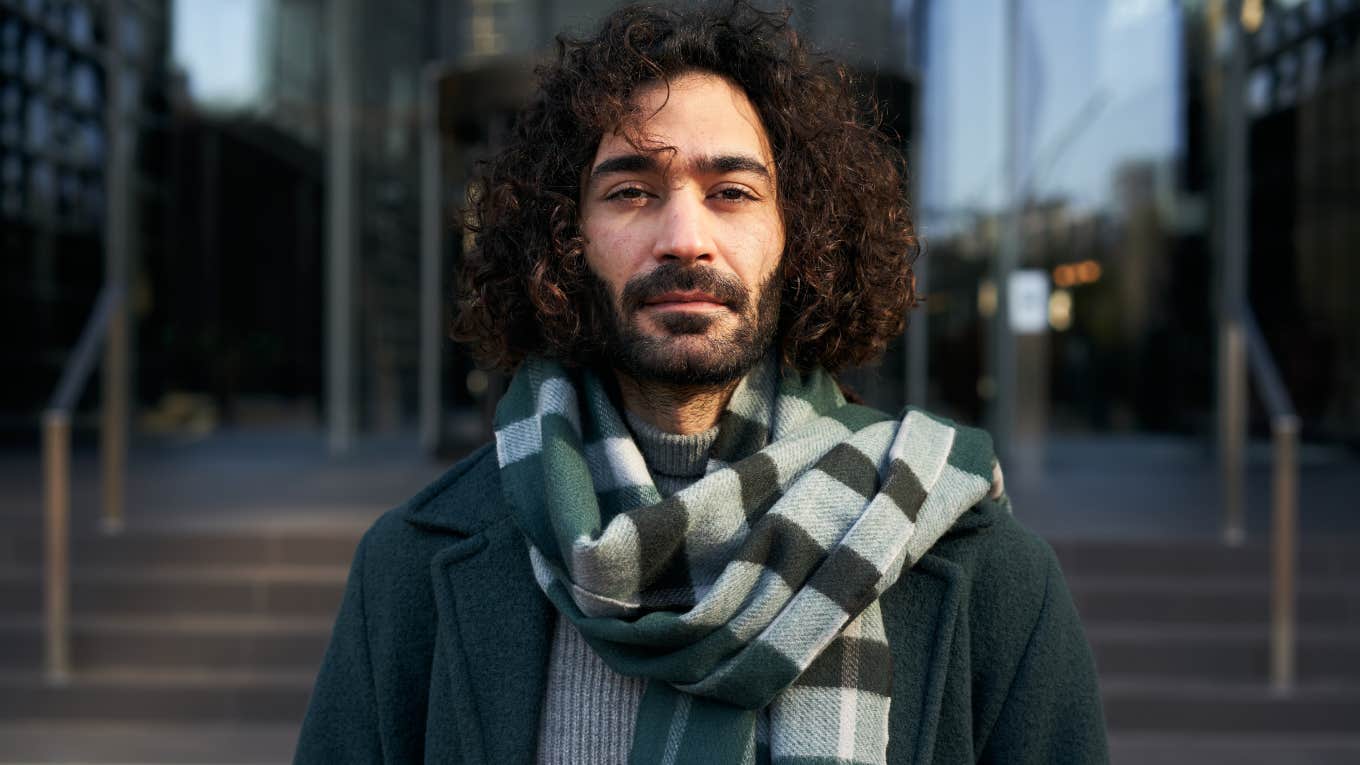 serious young Caucasian businessman looking at camera 