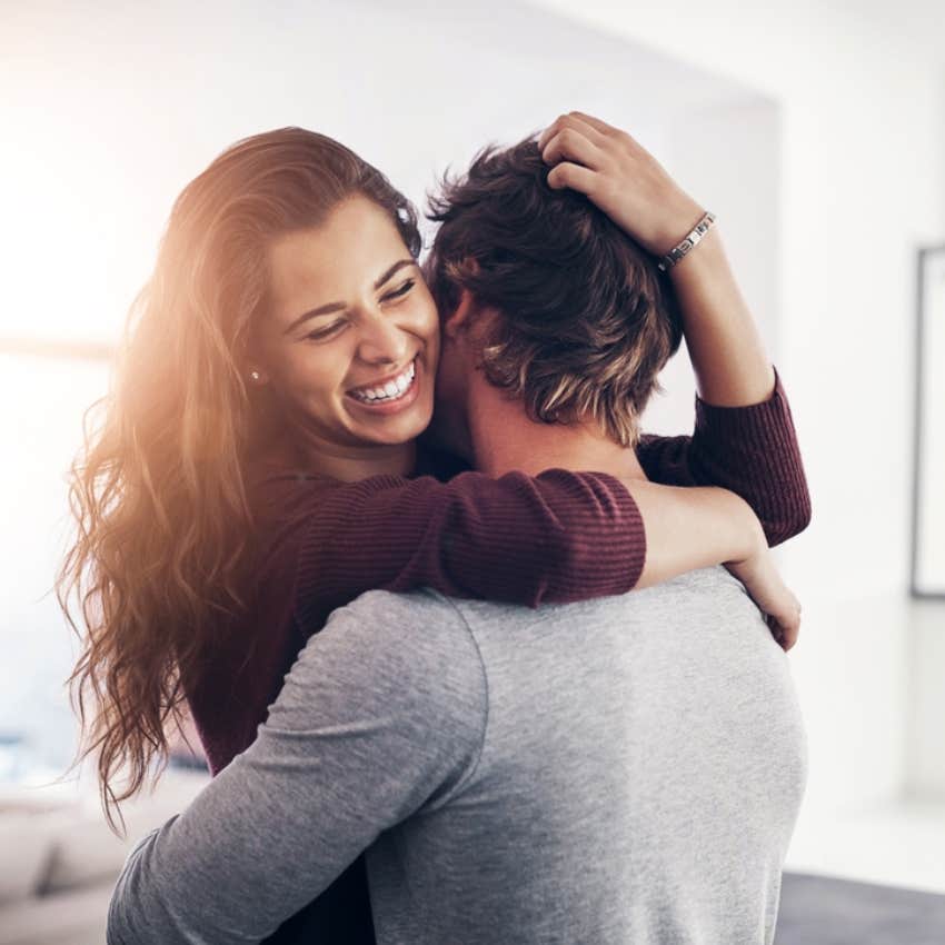 man and woman hugging 