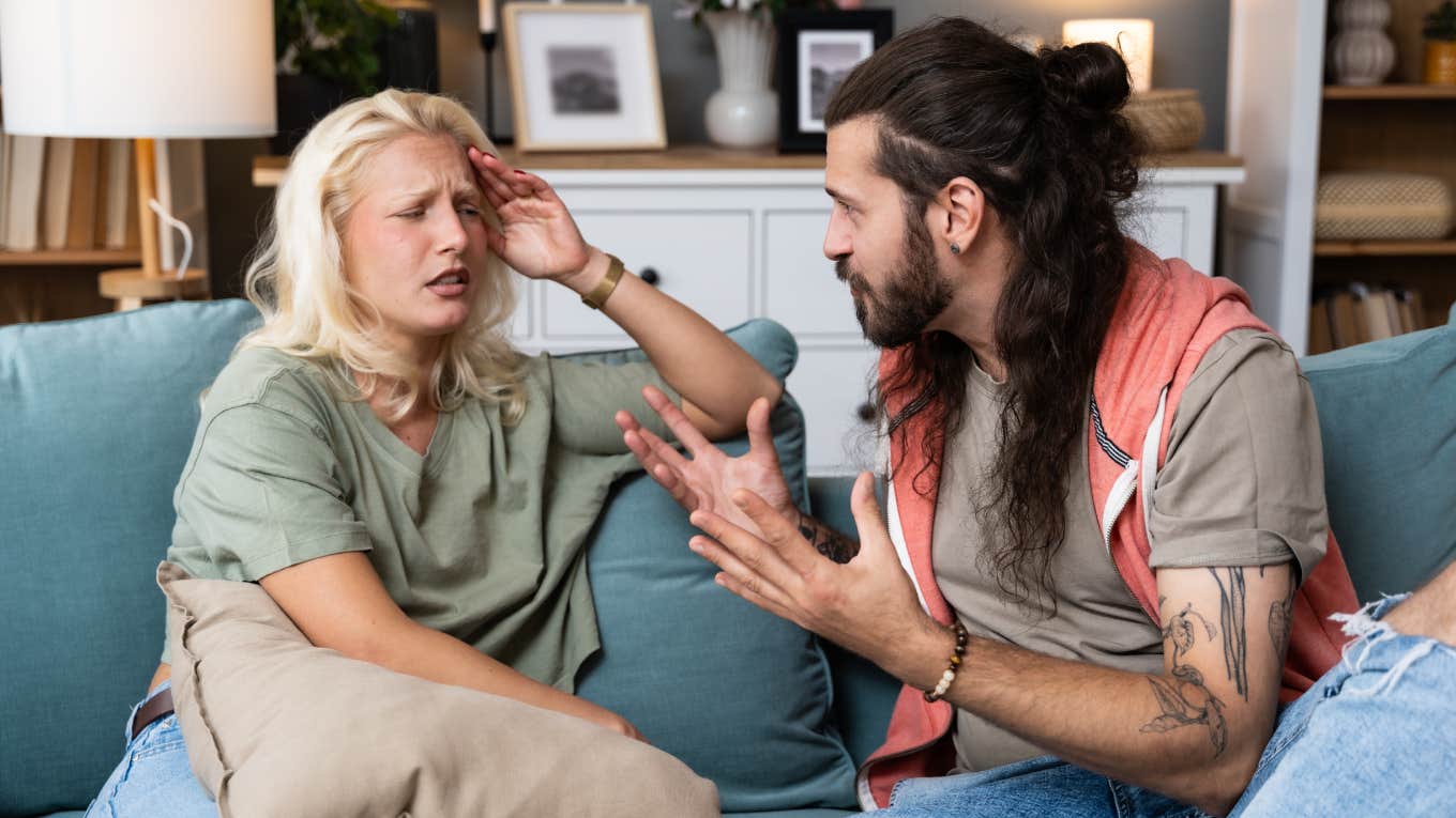 Young married couple husband and wife sitting at home having problems in their marriage