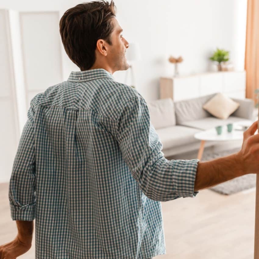 man walking into room