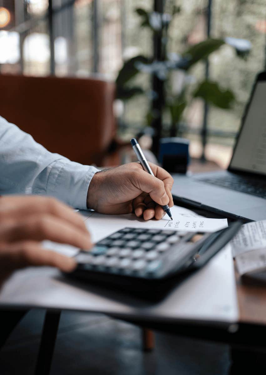 man using a calculator