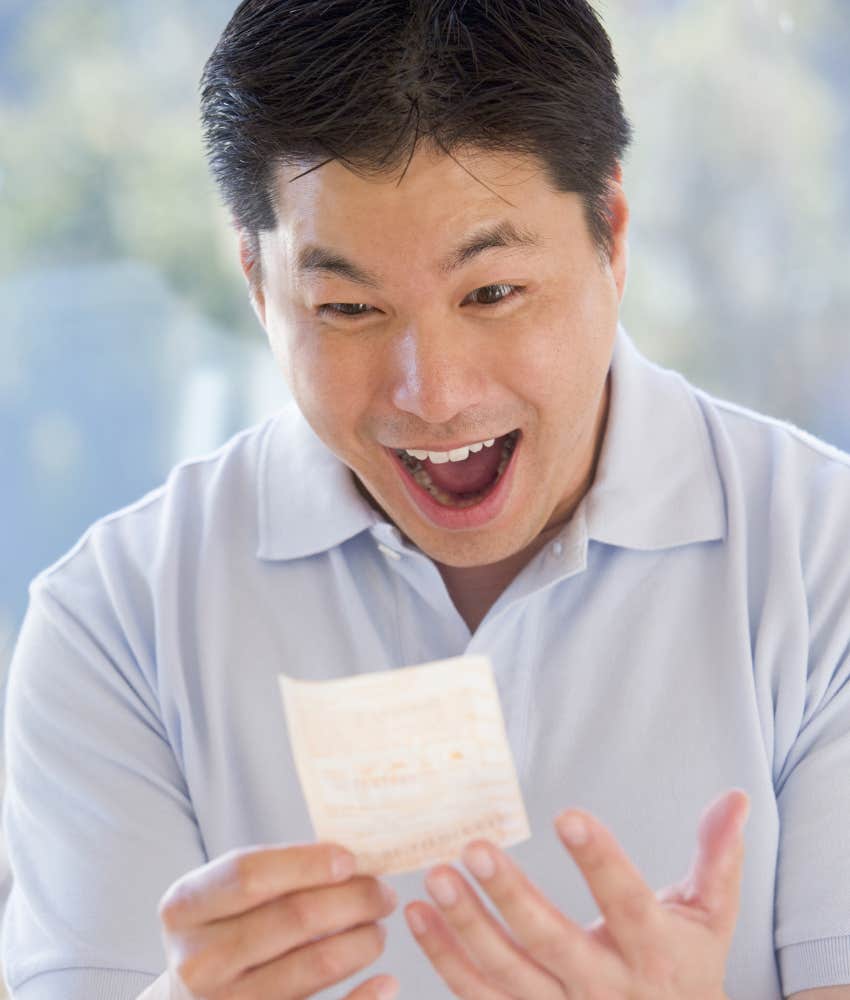 man with winning lotto ticket