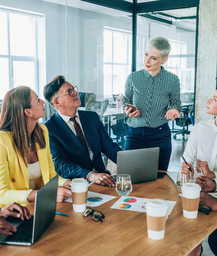 manager leading a team of employees during a meeting