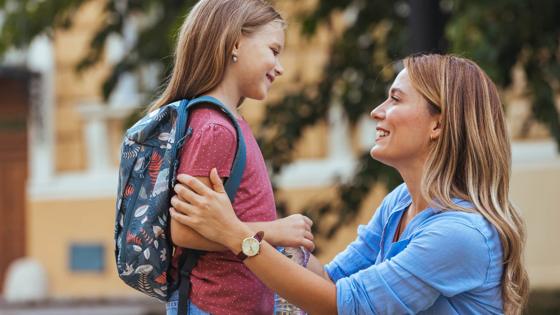 Mom talking intently to her young daughter.