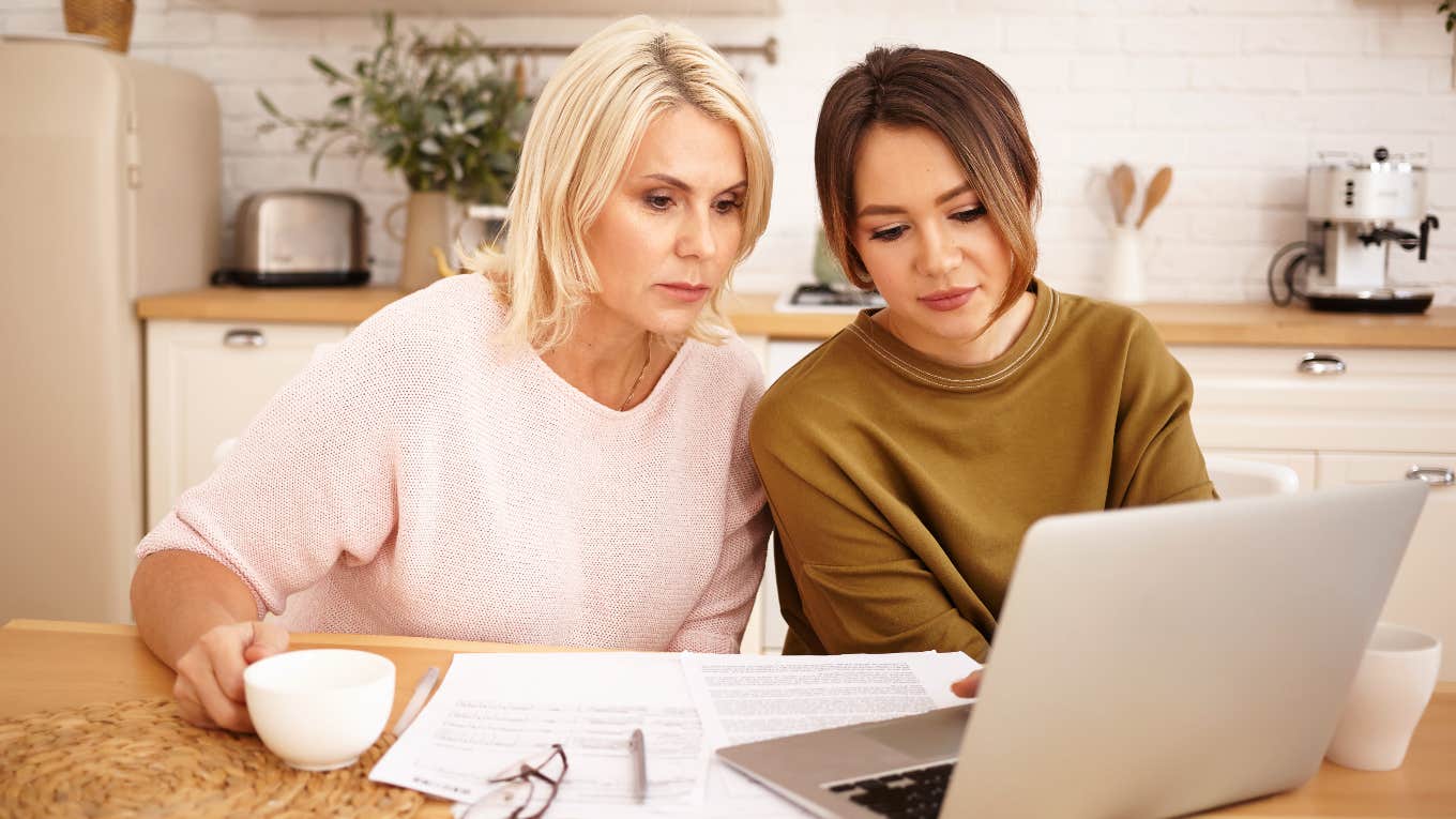 Mom and daughter looking at college scholarships