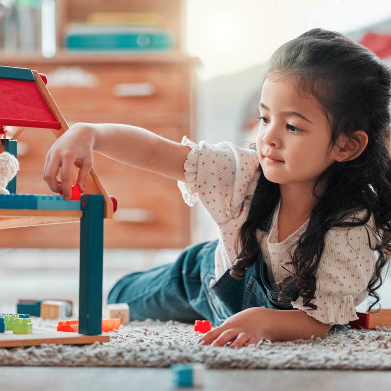 toddler playing with toys