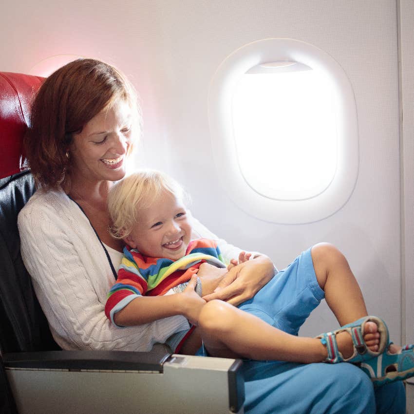 Mom with child in second best seat on an airplane