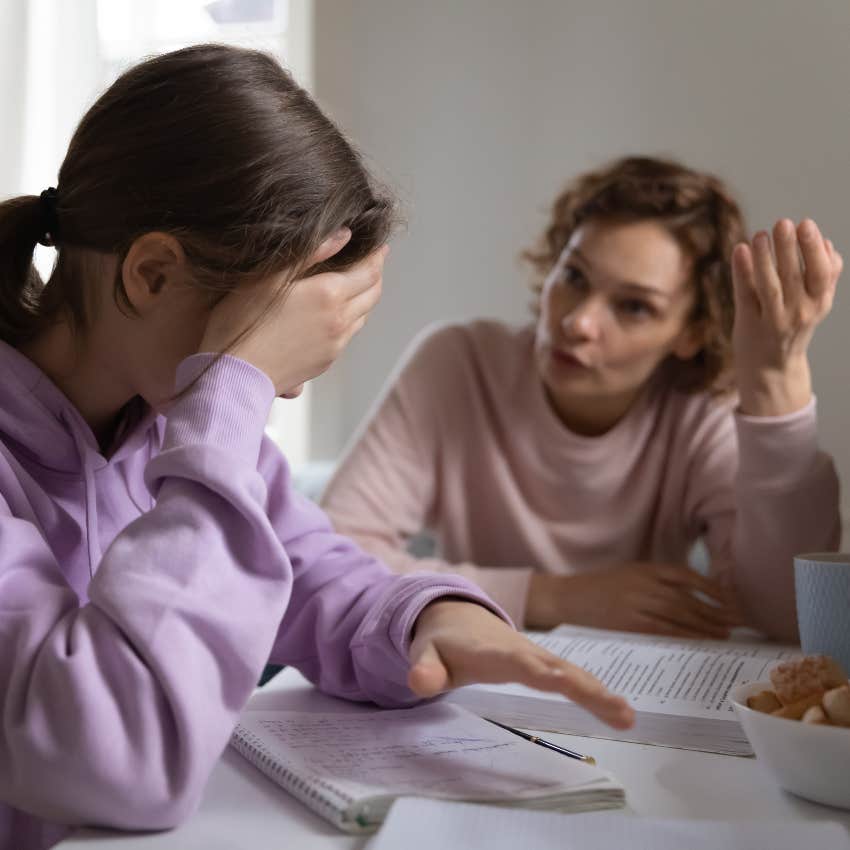 Mom scolding her teen daughter about her grades