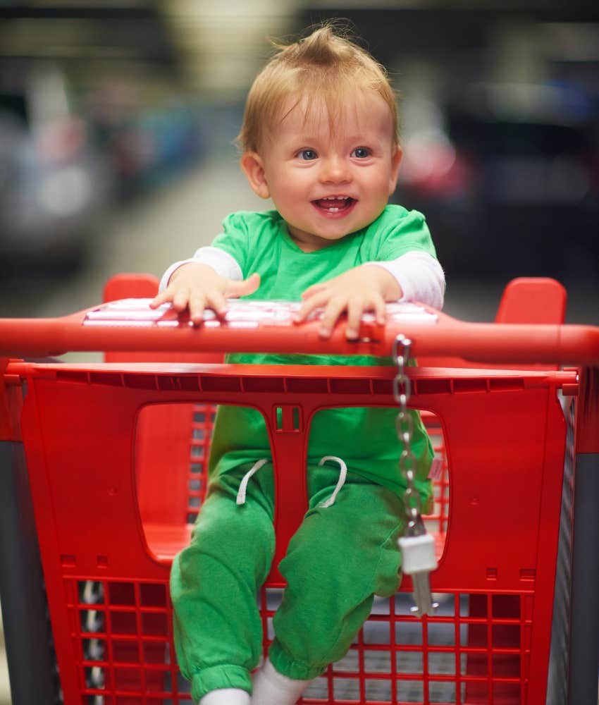 baby smiling in Target shopping cart