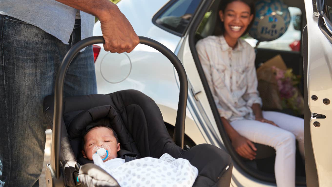 New dad bringing his baby to the car