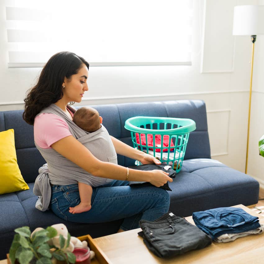 Postpartum wife on maternity leave doing housework