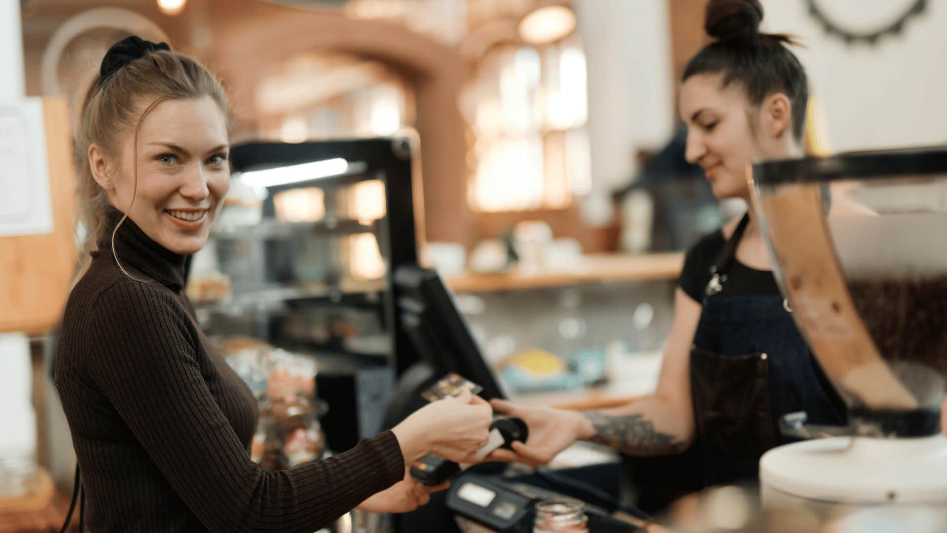 woman paying cashier