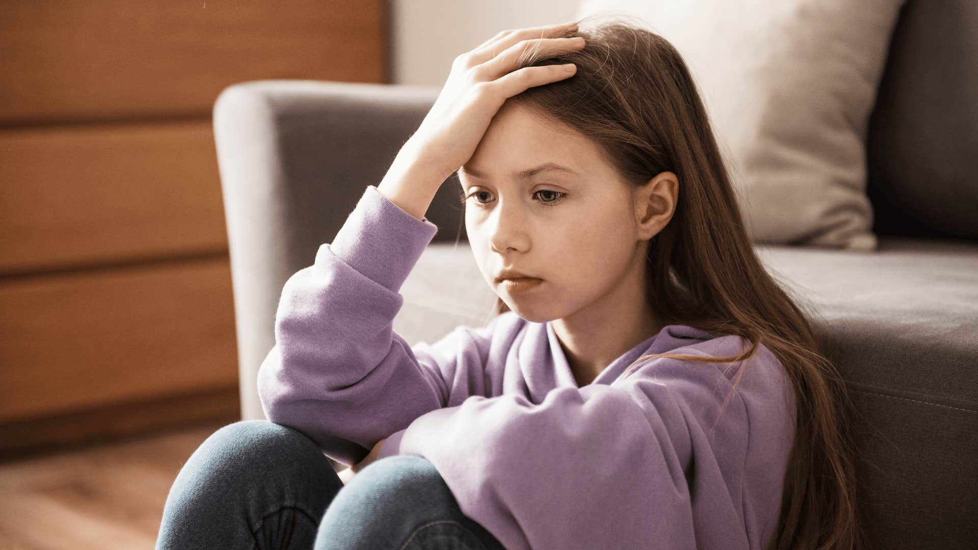 young girl sitting alone