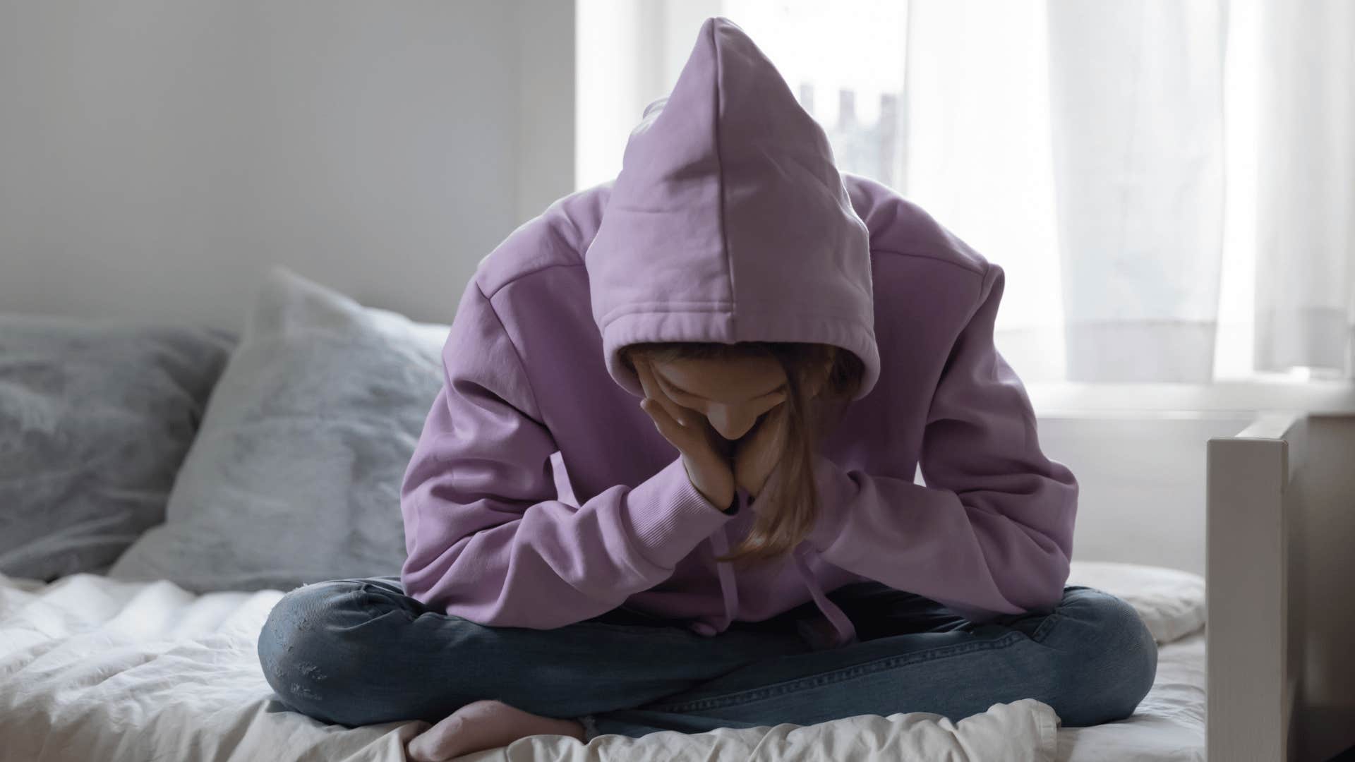 girl alone in her bedroom