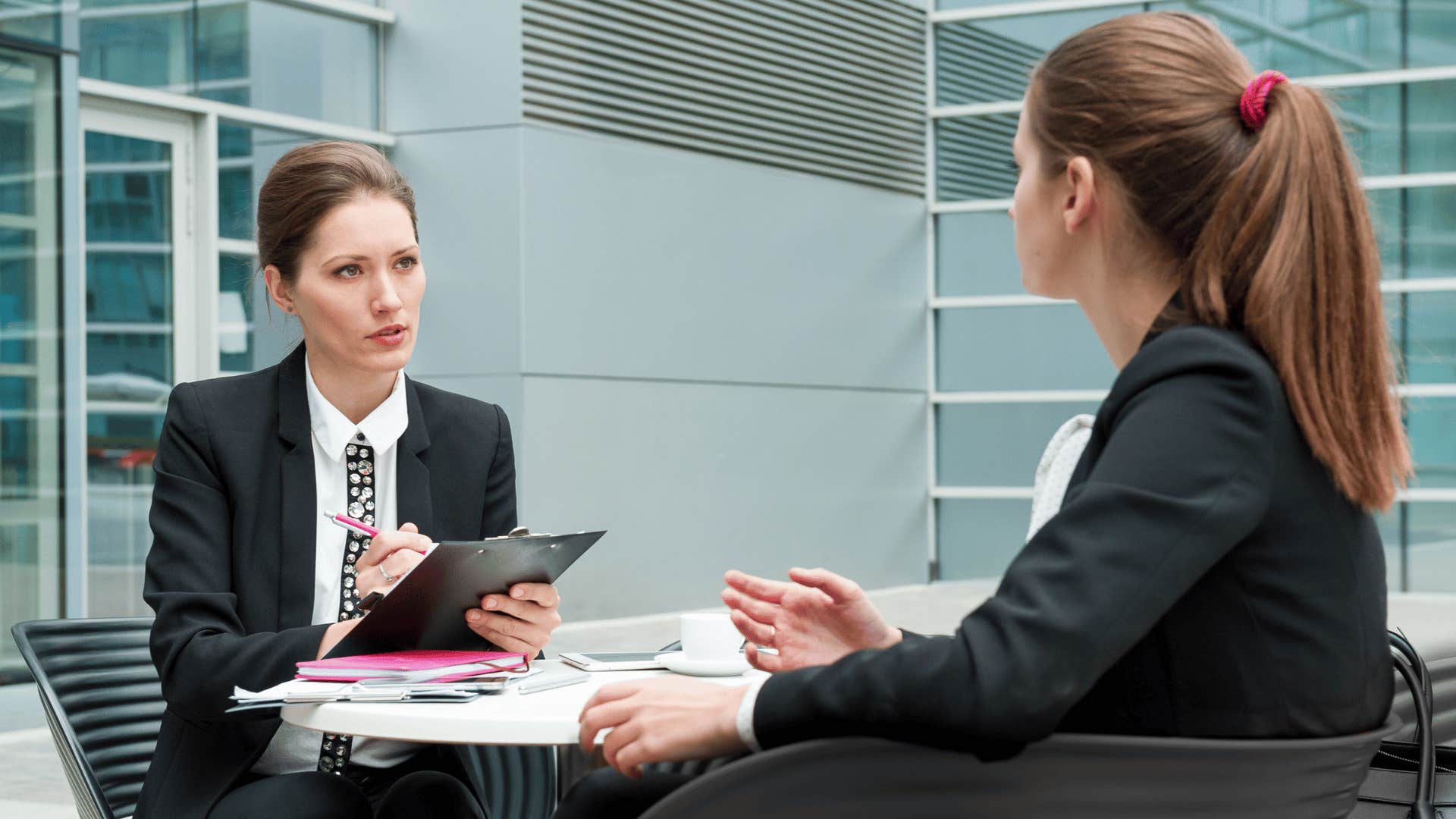 two coworkers discussing something 