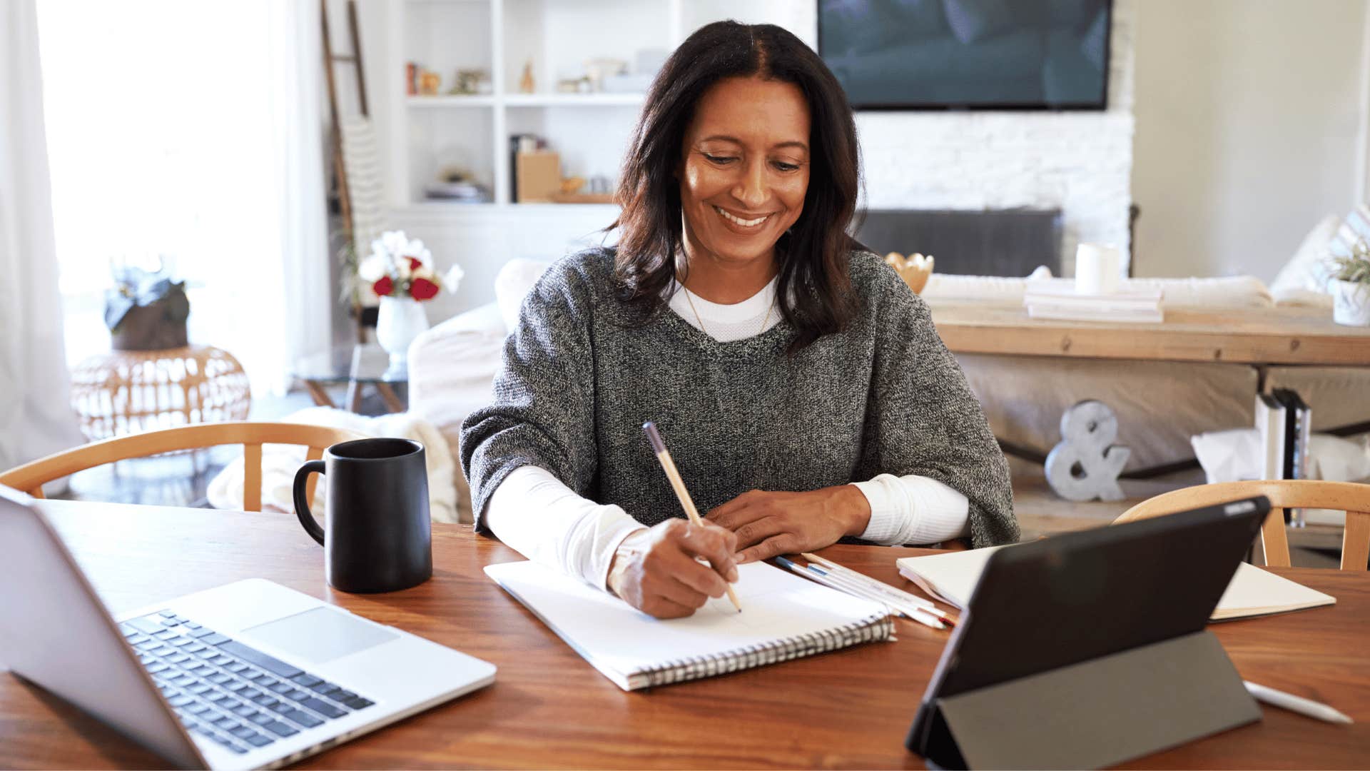 woman writing in notebook