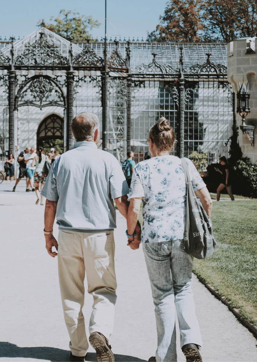 older couple walking hand in hand