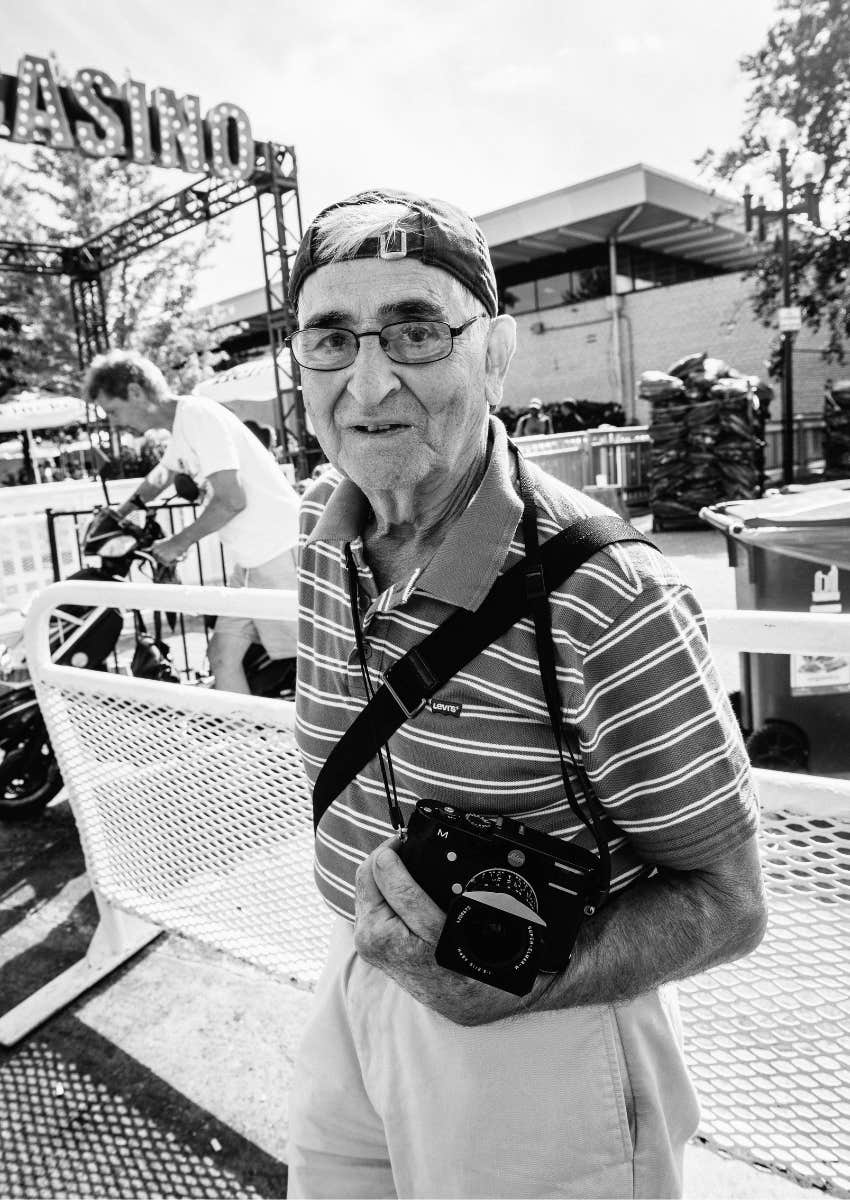 older gentleman holding a camera