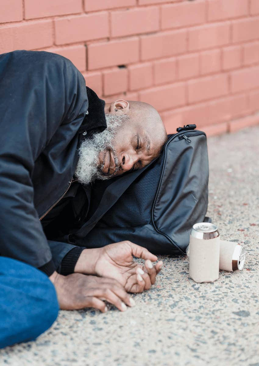 older man sleeping outdoors