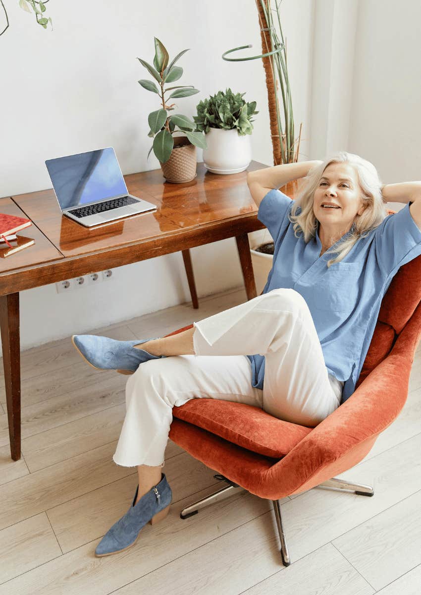 older woman relaxing and leaning back in chair