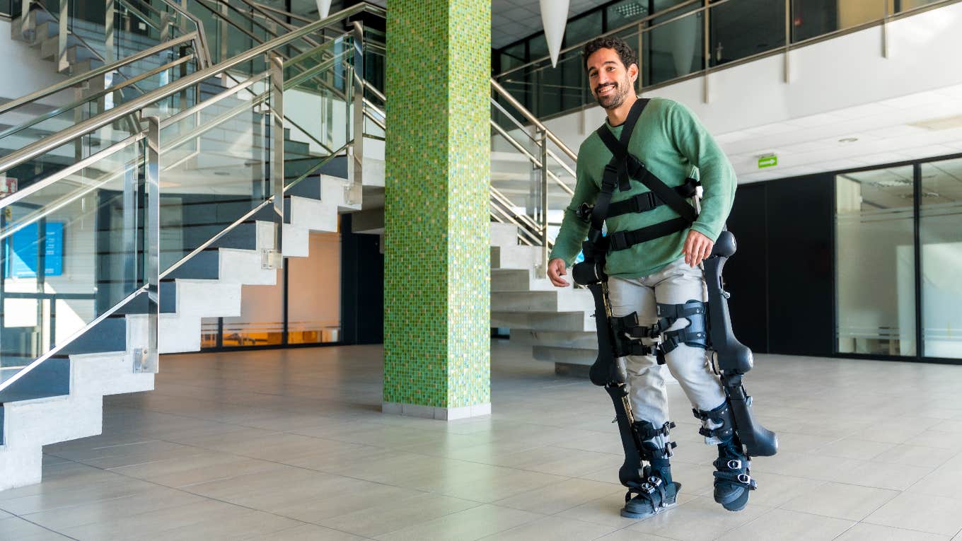 Man using exoskeleton to walk