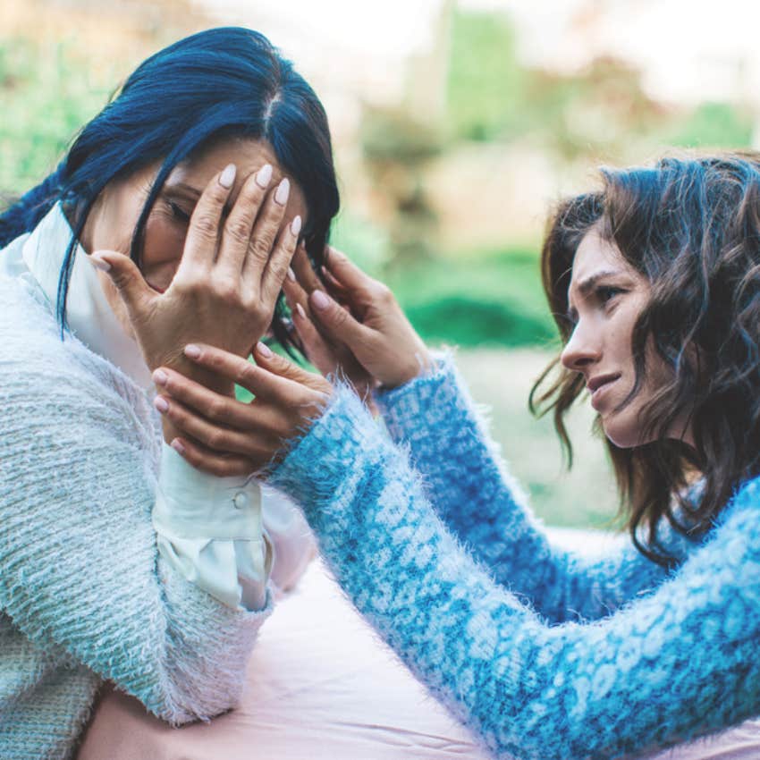 woman helping upset stranger 