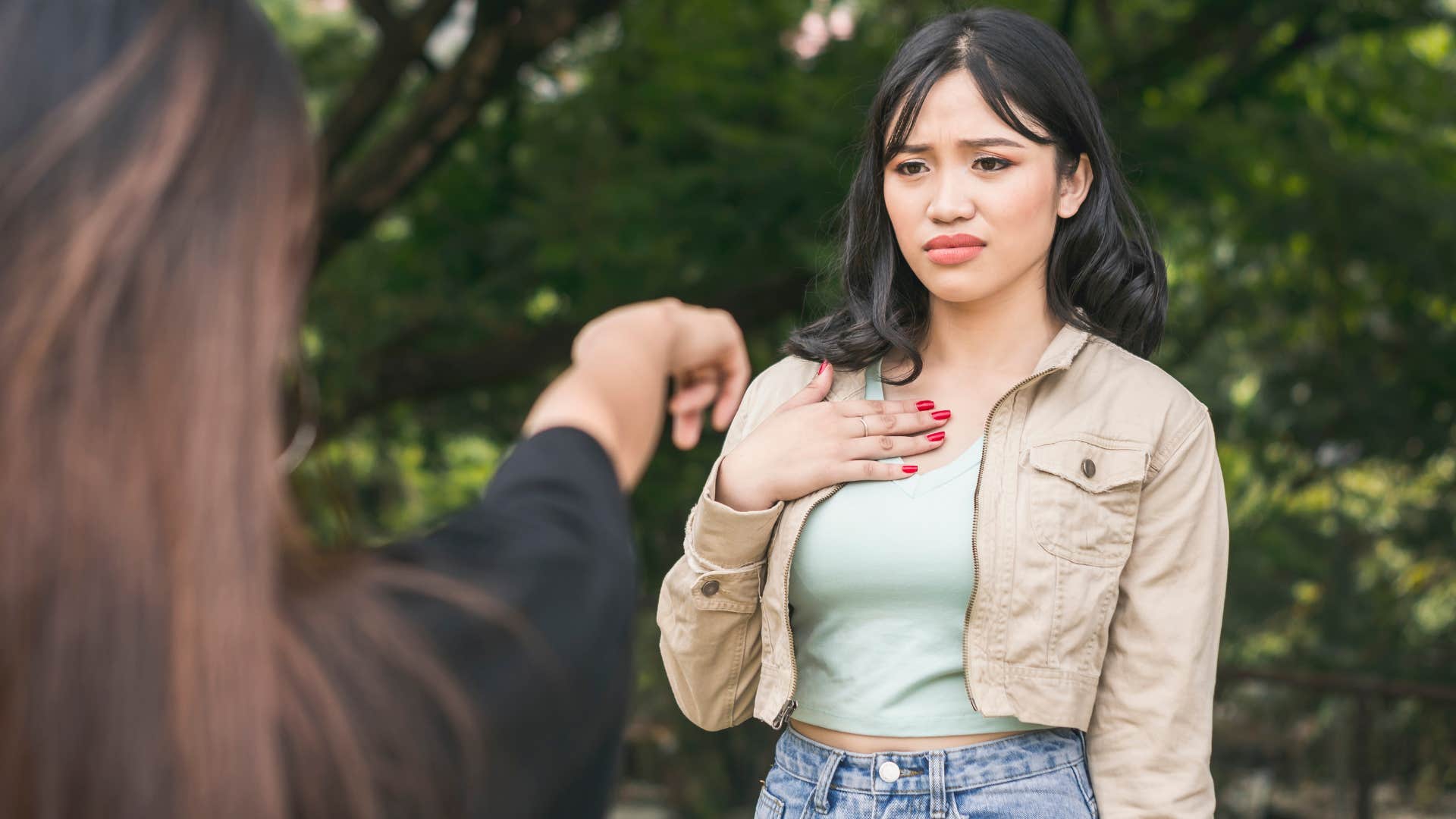 Woman looking defensive during an argument. 