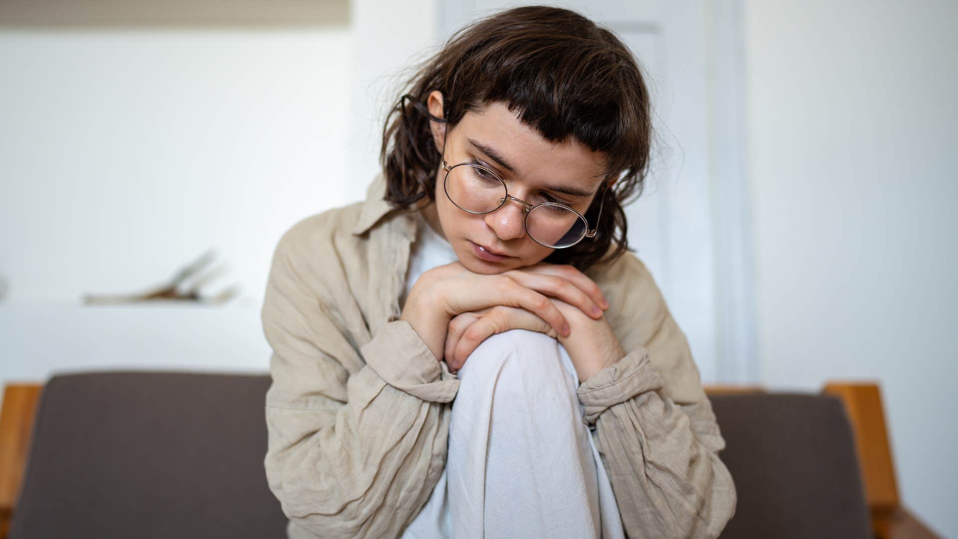 Young woman looking stressed and sad.