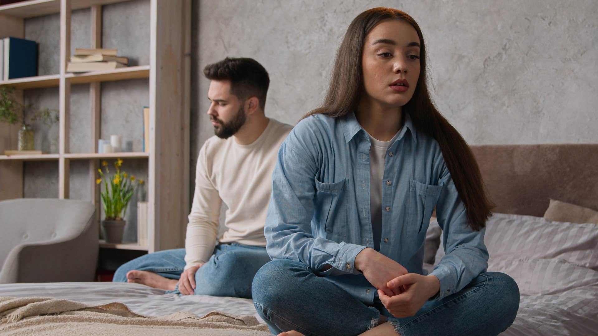 Woman sitting turned away from her partner.