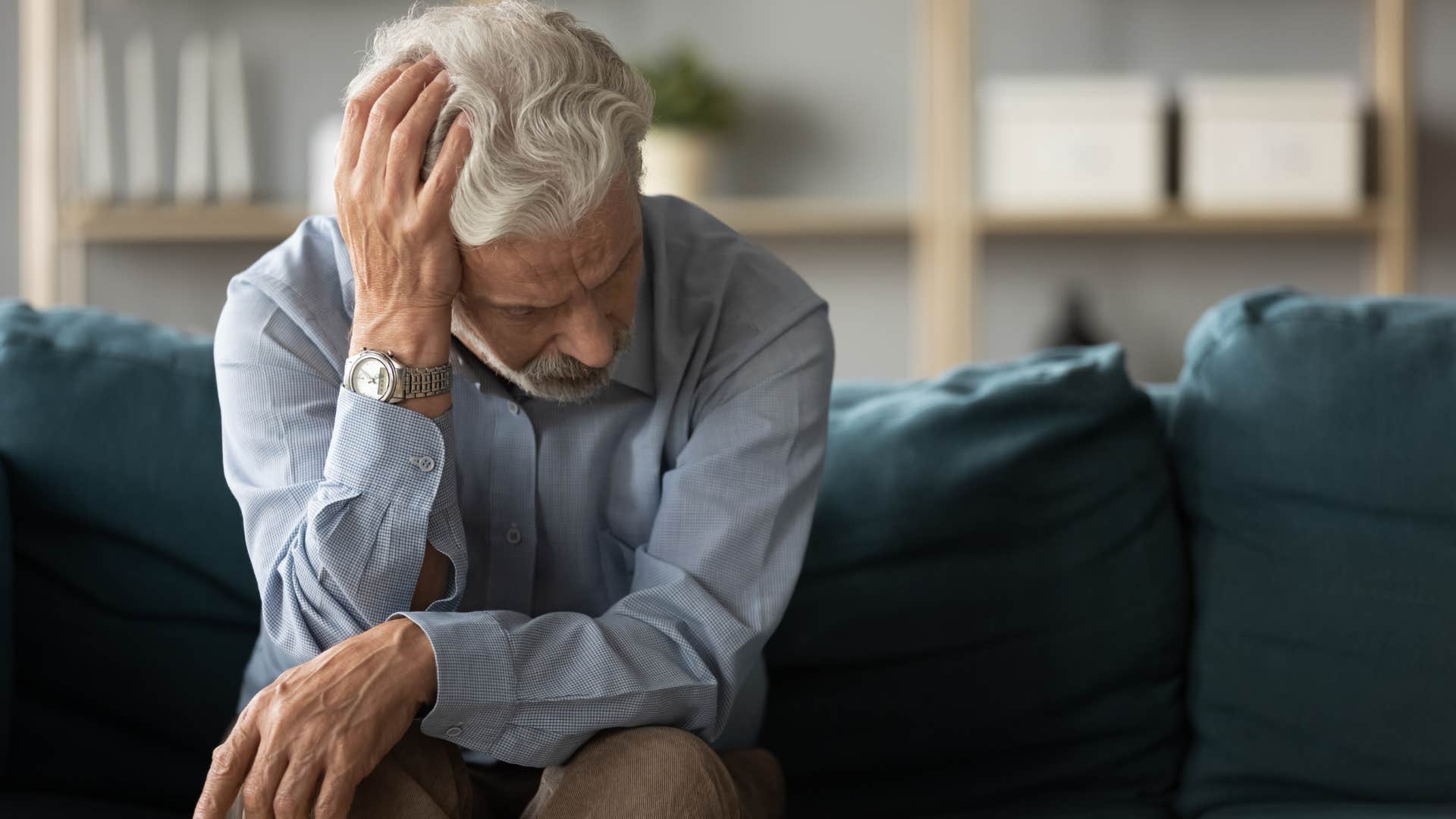 Adult man looking lonely on the couch