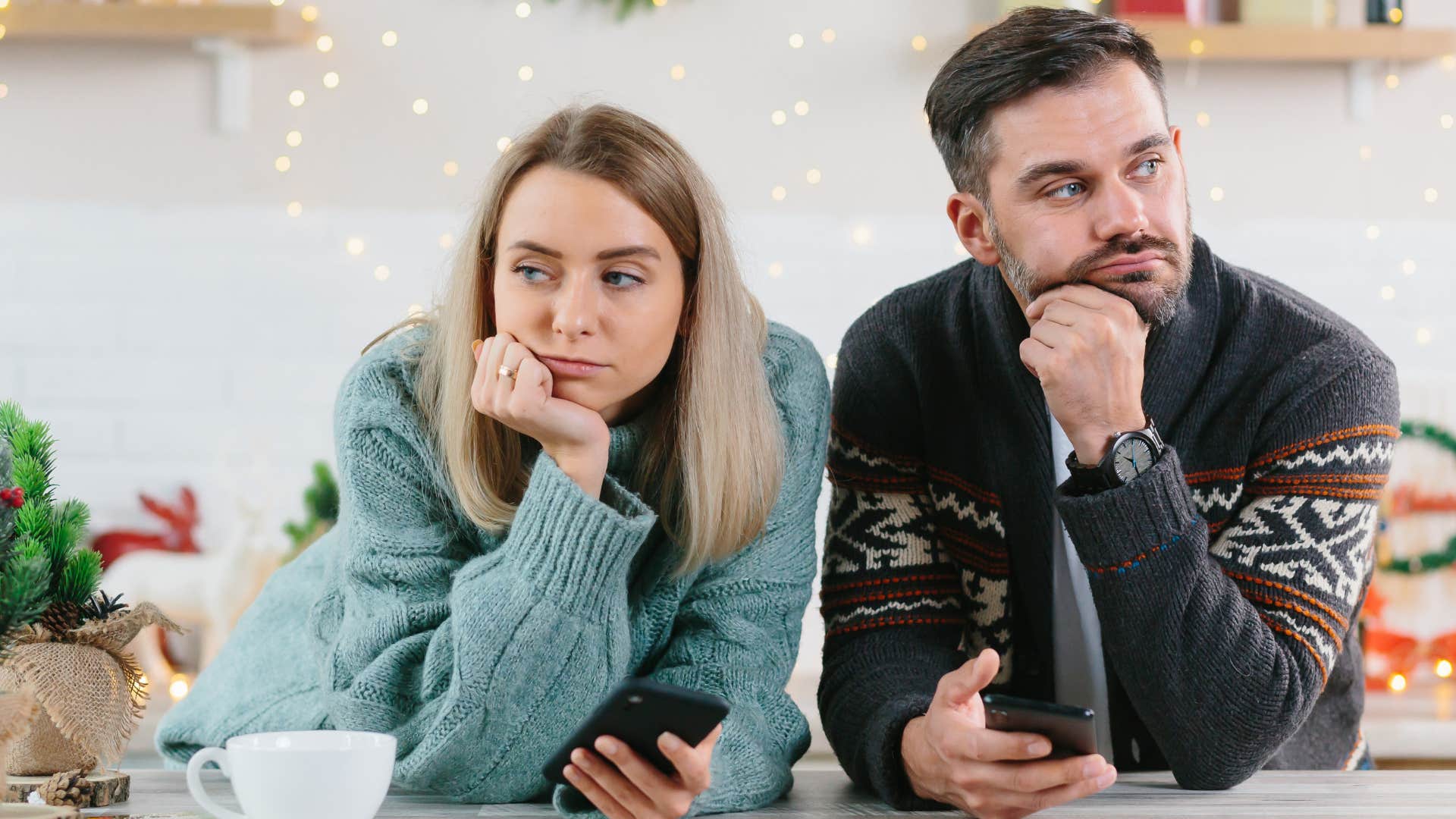 Couple looking annoyed at a holiday party.