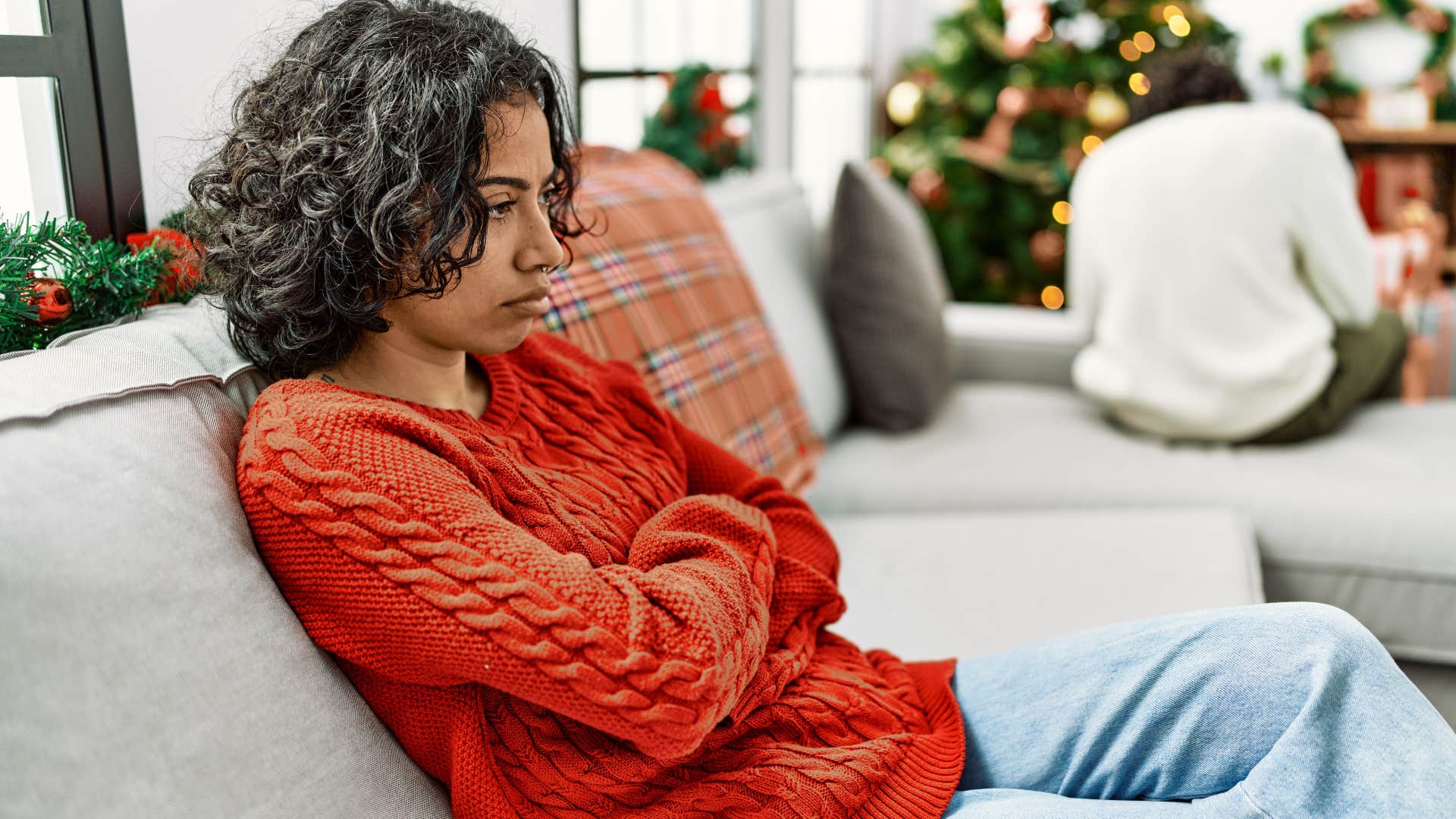 Woman looking annoyed at a holiday party.