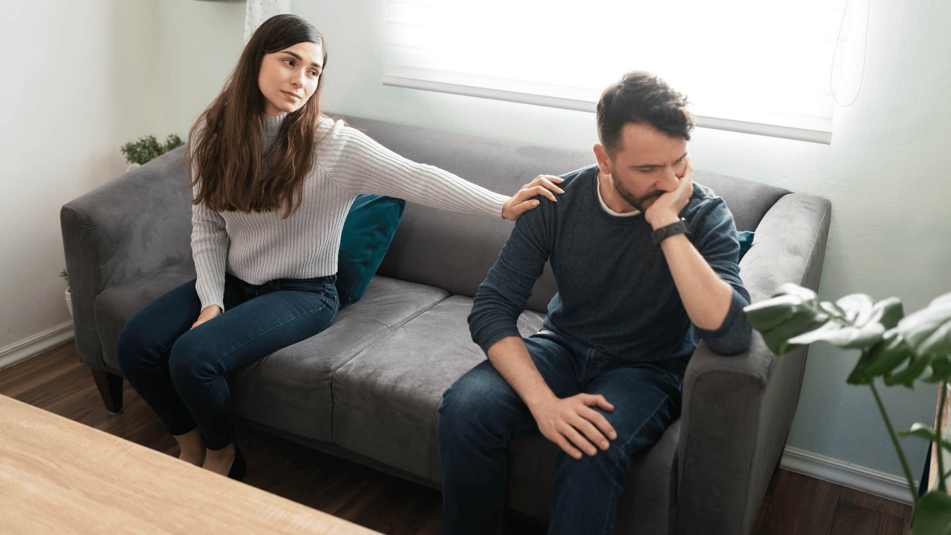 woman comforting her husband