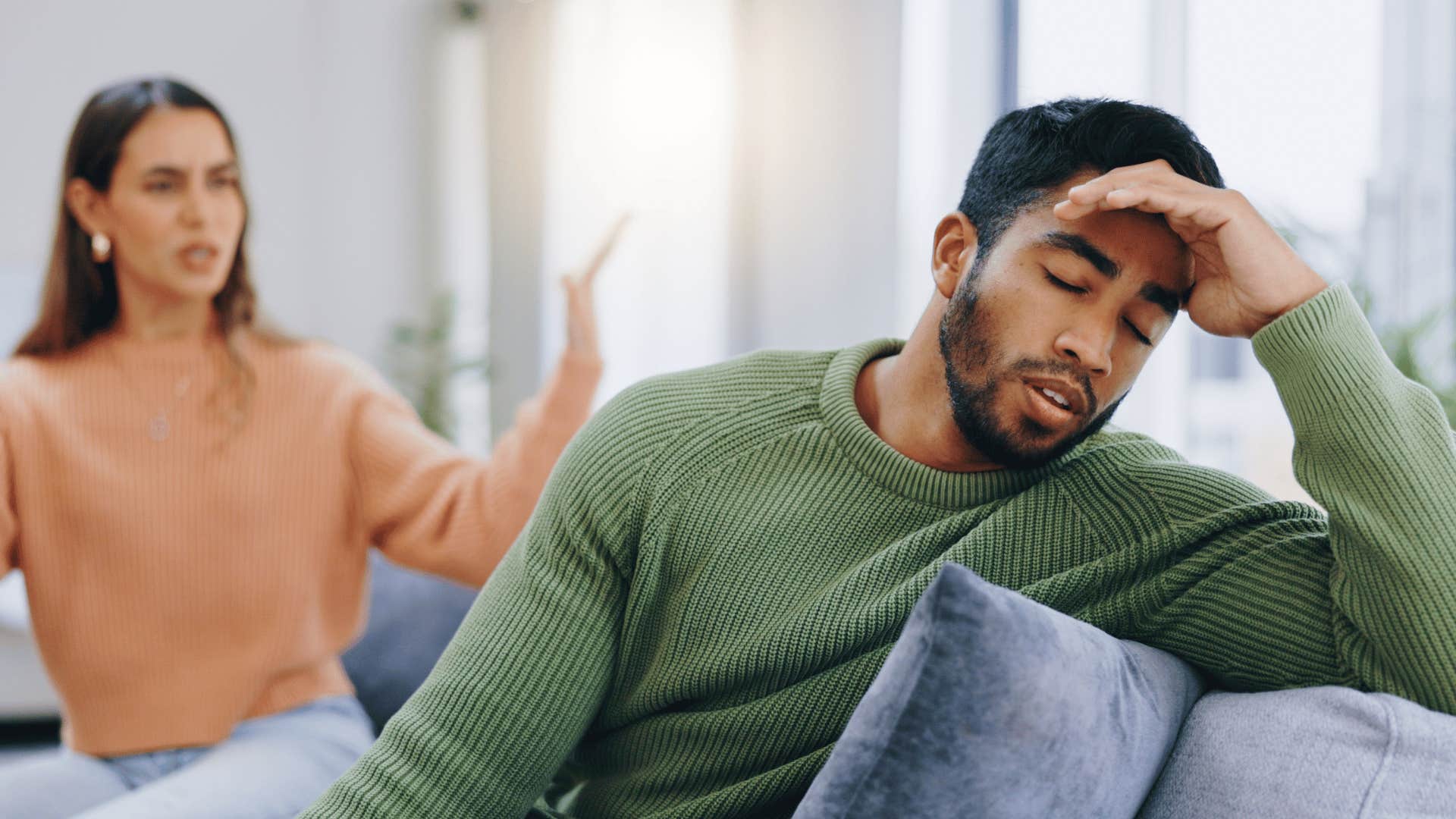 couple arguing on couch