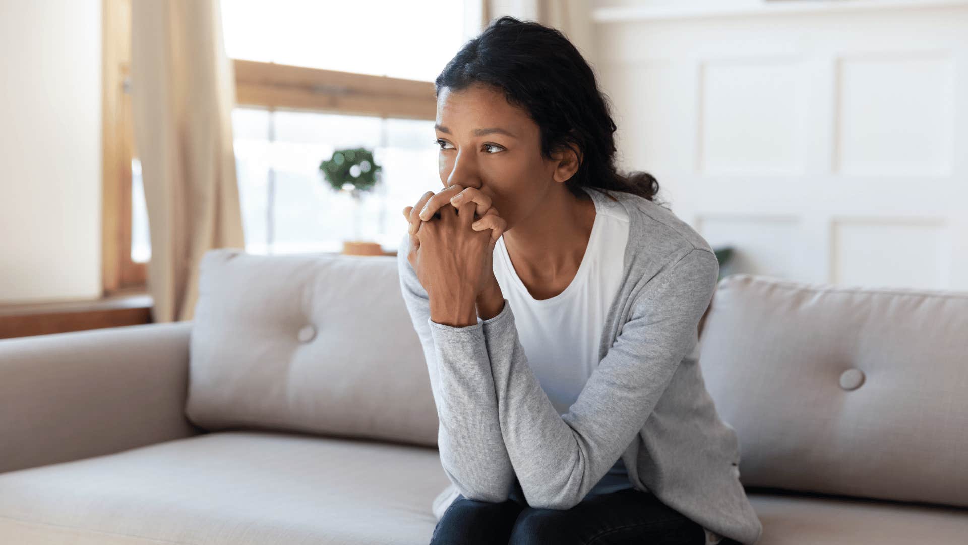 sad woman on couch