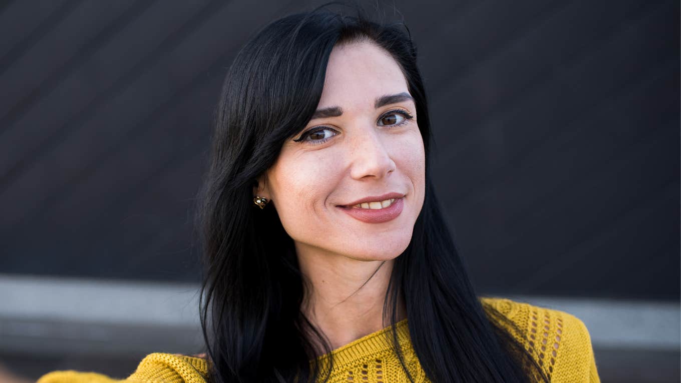 dark haired woman smiling