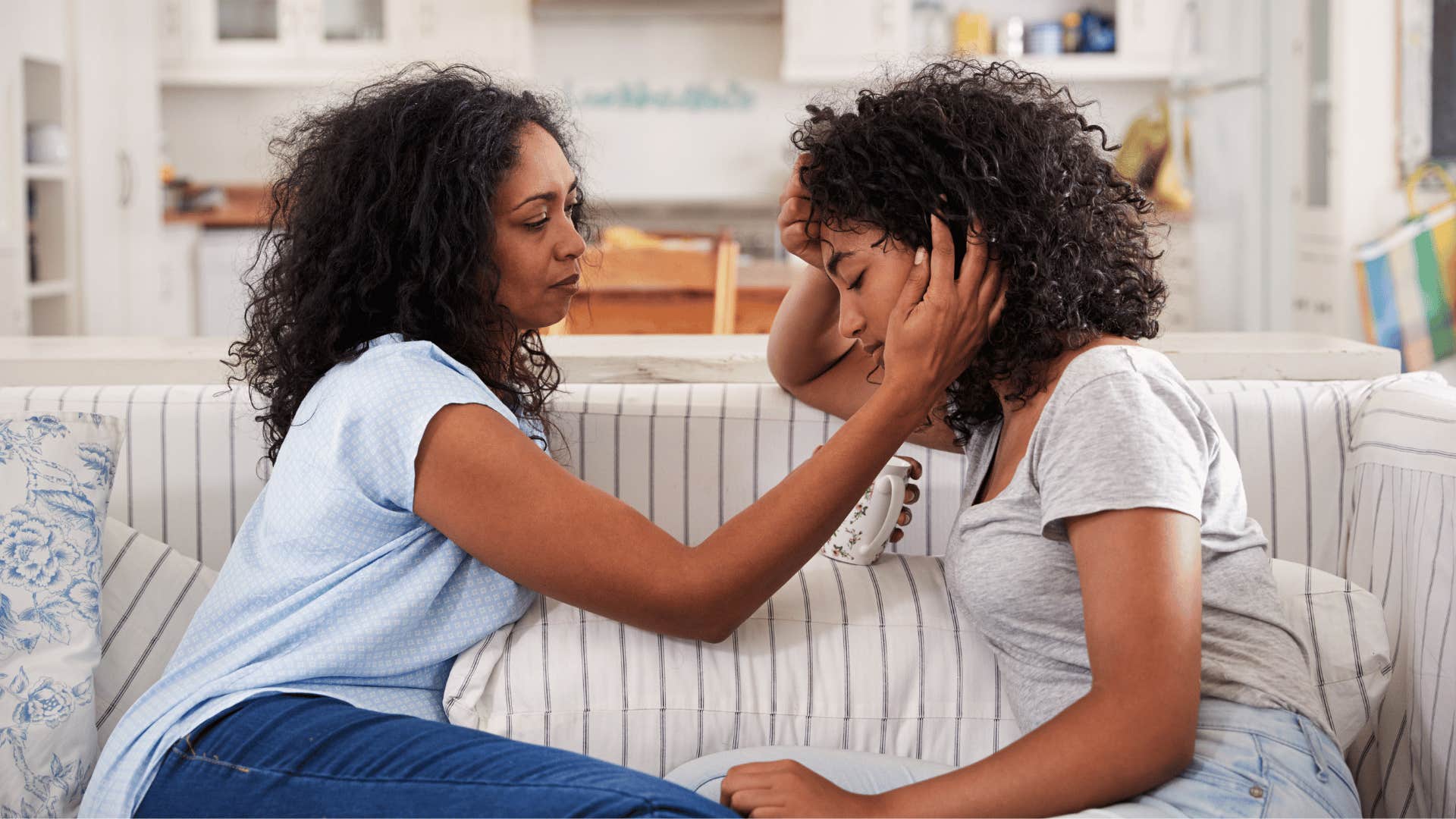 mom comforting daughter