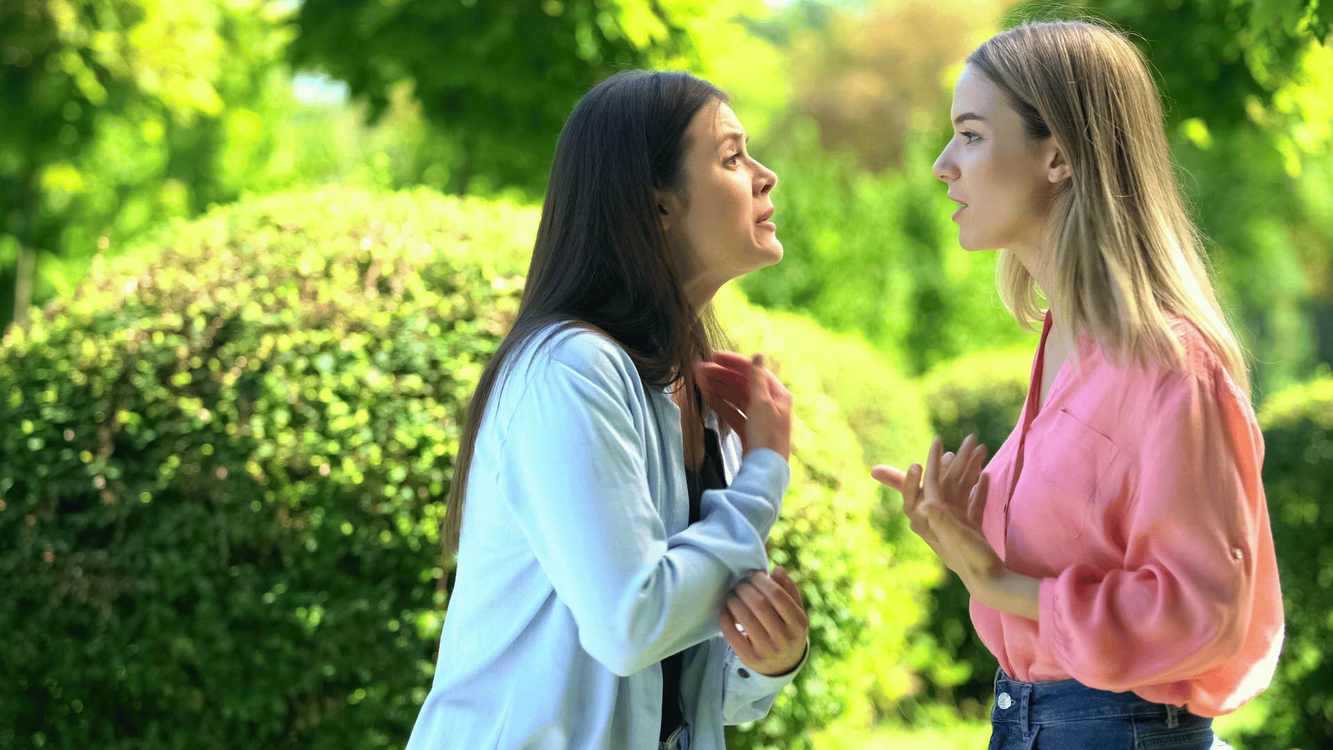 two women arguing outside 