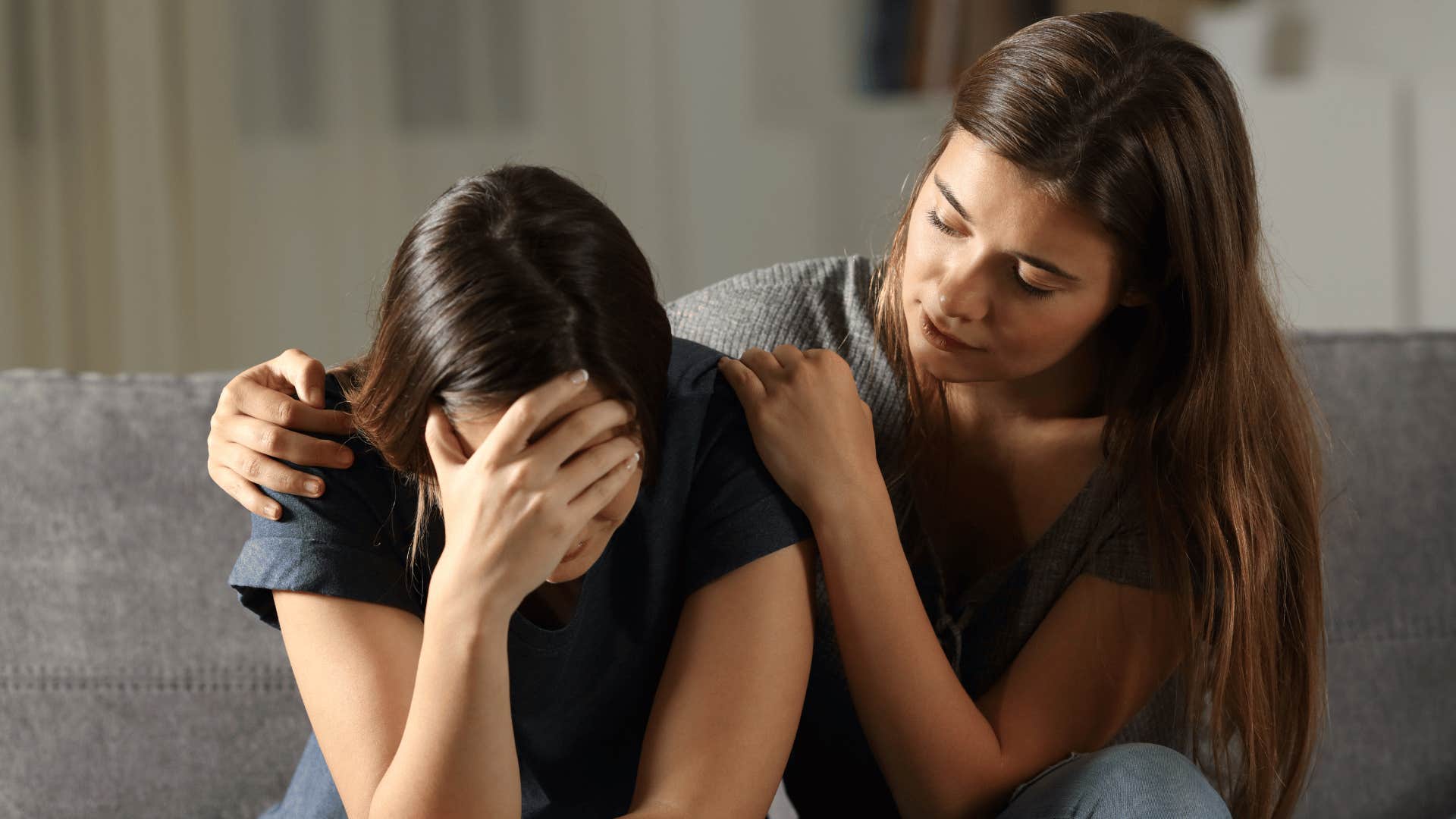 woman comforting upset friend 