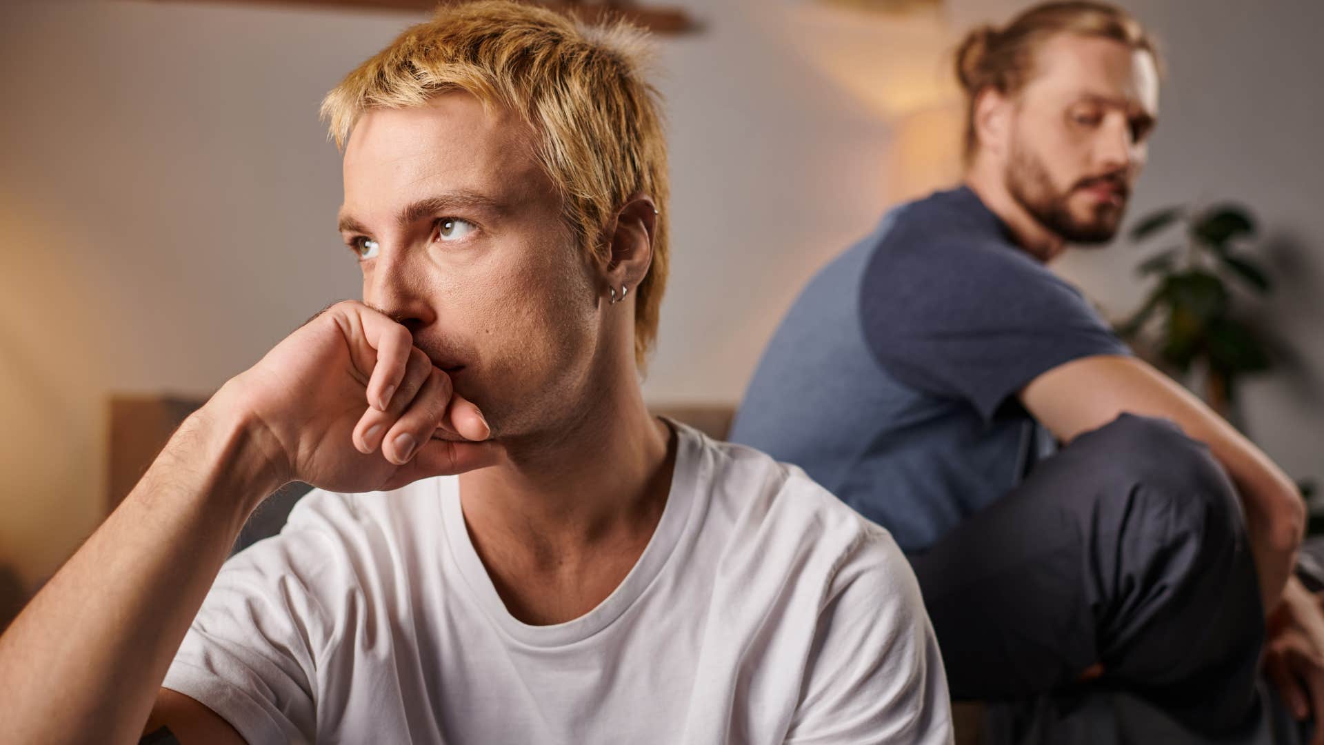 Man looking upset staring away from his partner