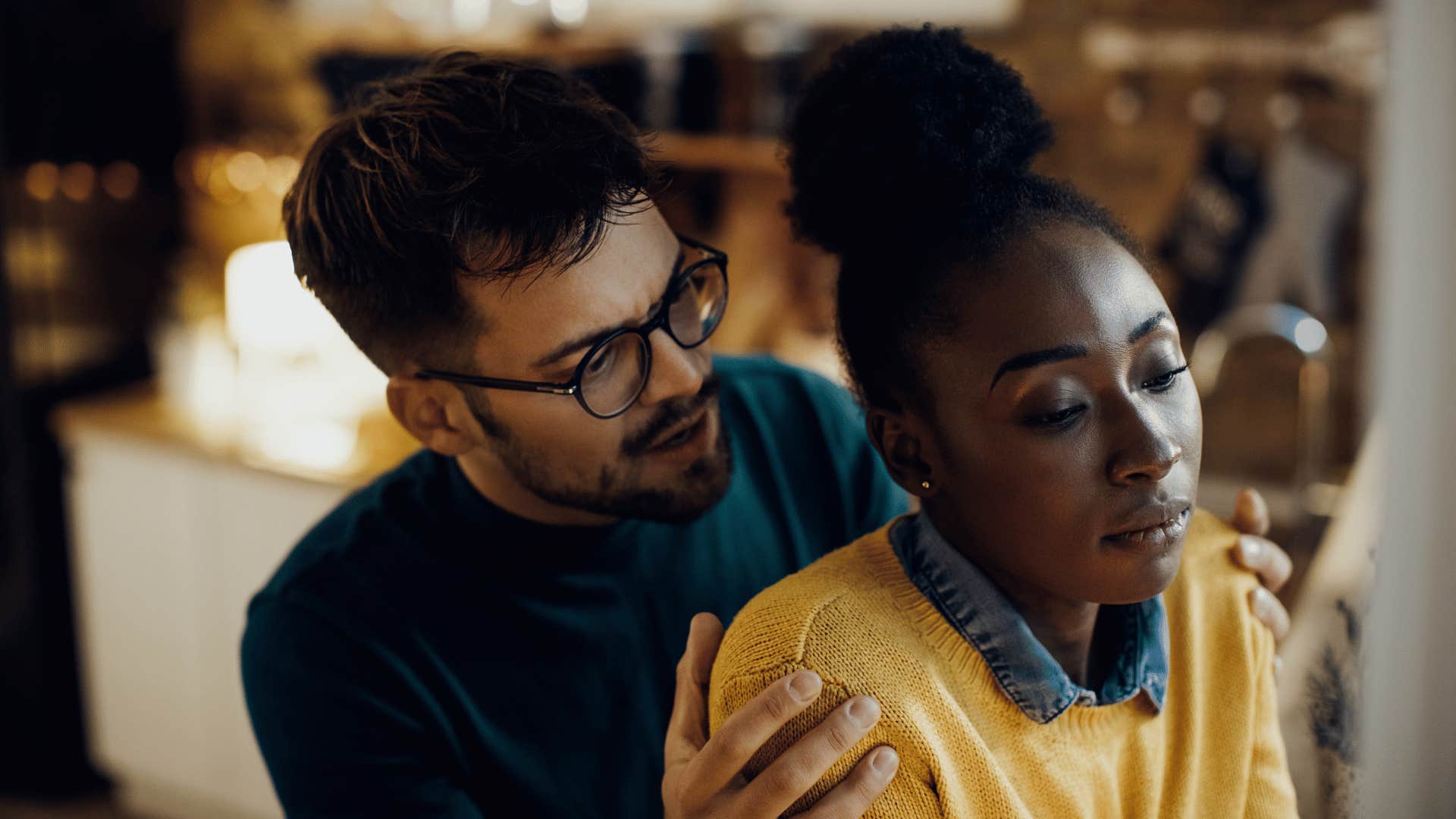 man trying to comfort upset woman